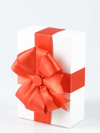 box with red ribbon on whiteの写真素材