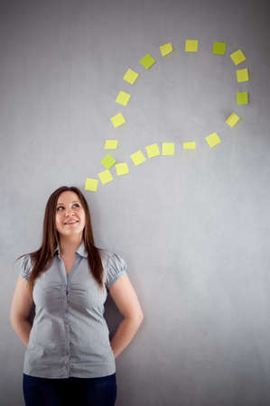 a young attractive woman thinkingの写真素材
