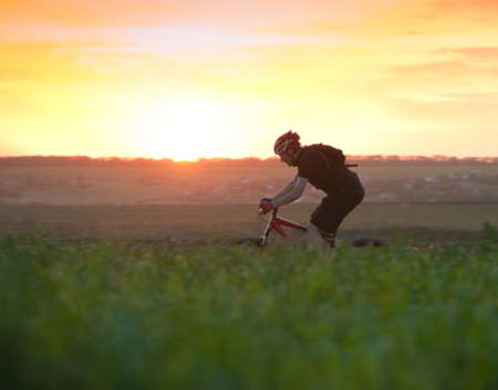 man relax biking at sunsetの写真素材