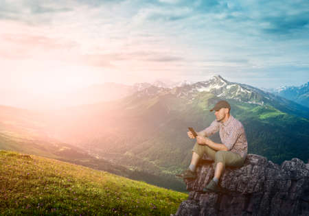 man working outdoors with tablet pad