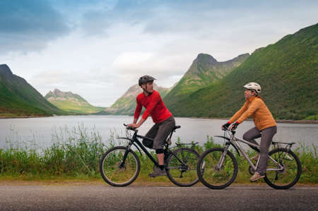 two cyclists relax biking outdoorsの写真素材