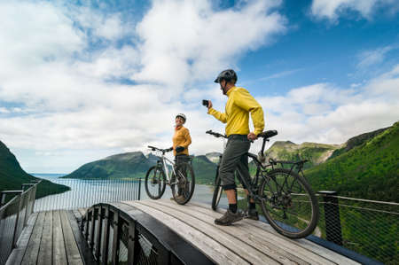 two cyclists relax biking outdoorsの写真素材