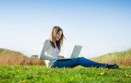 girl with laptop outdoorsの写真素材