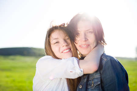 mother with daughter outdoorsの写真素材