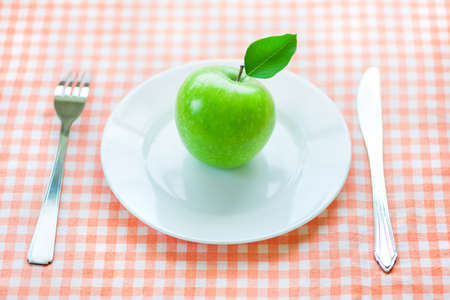 dieting with green appleの写真素材