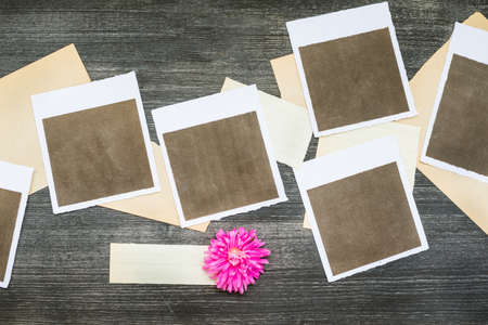 polaroids with old papers backgroundの写真素材