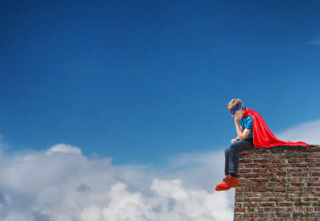 a boy acting like a super heroの写真素材