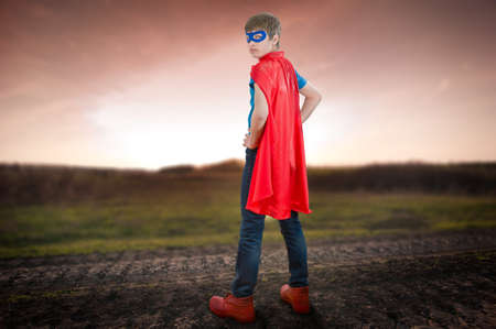 a boy acting like a super heroの写真素材