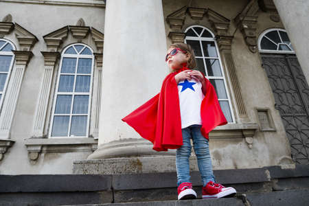 a girl acting like a super heroの写真素材
