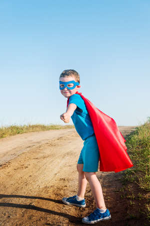 child acting like a super hero の写真素材