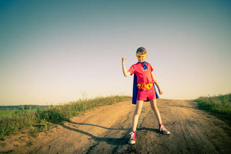 child acting like a super hero の写真素材