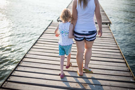 child together with mother outdoorsの写真素材