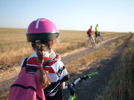 family cycling in summerの写真素材