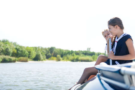 children sailing on boatの写真素材