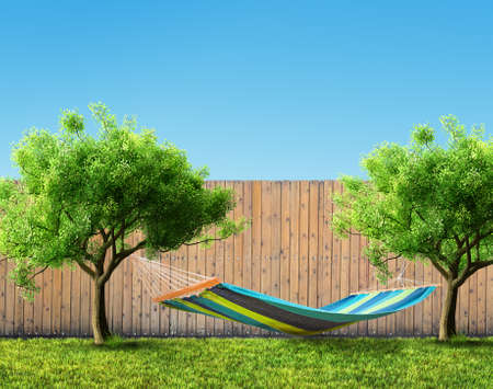 Relaxing on hammock in backyardの写真素材