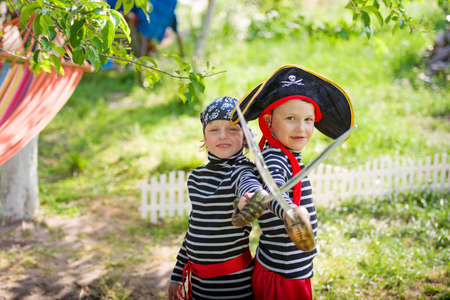 children play pirates outdoorsの写真素材