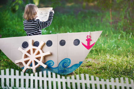 kid plays pirate at backyardの写真素材