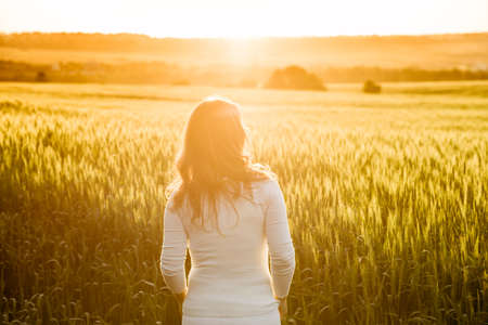girl in field at summer