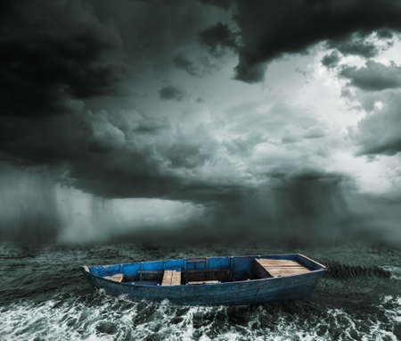 old boat in the stormy oceanの写真素材