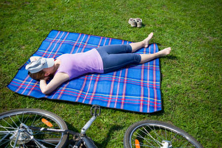 woman lying on grassの写真素材