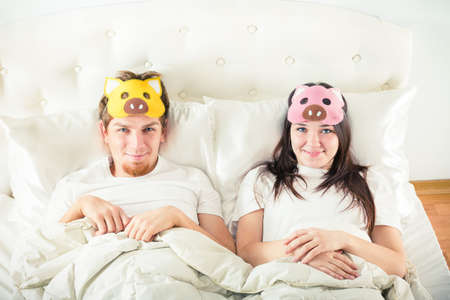 playful couple in bedの写真素材