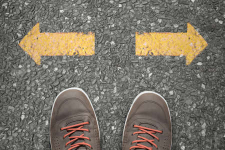 Walking direction on asphaltの写真素材