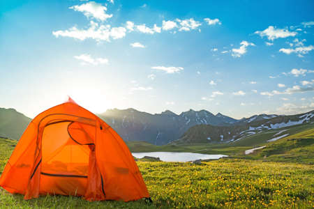 tourist tent camping in mountainsの写真素材