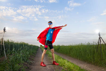 funny superhero taking a photoの写真素材
