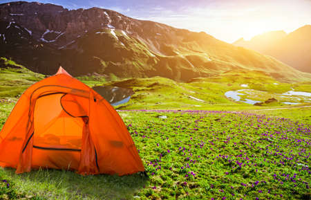 tourist tent camping in mountains