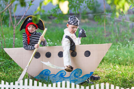 children play pirates at backyardの写真素材
