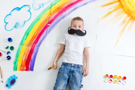 kid painting rainbowの写真素材