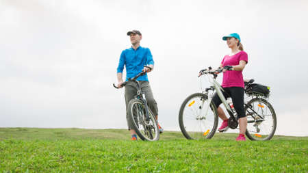 couple cycling outdoors