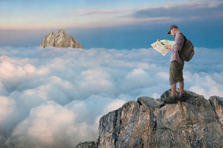man hiking and got lost in the mountainsの写真素材