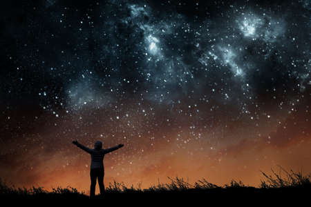 Girl watching the stars in night sky
