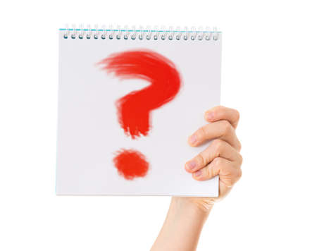 hand holding notebook with question mark