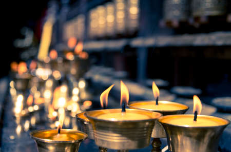 candles in temple in Nepalの写真素材