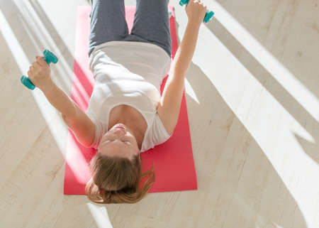 portrait of young obese woman working out home