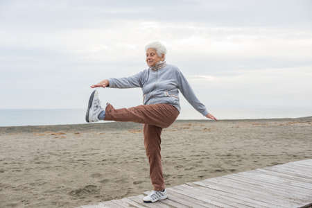senior woman exercising outdoorの写真素材