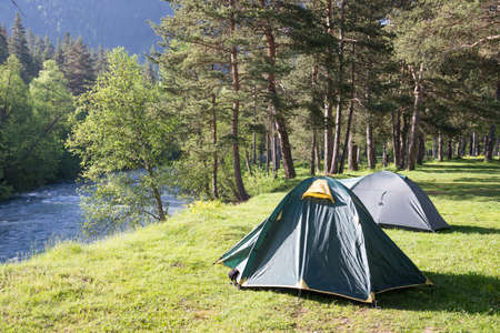 tourist tent camping in mountainsの写真素材