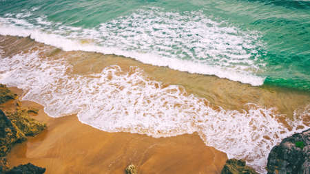 waves in sea and sand beach