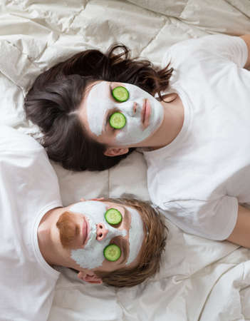 Couple getting homemade facial maskの写真素材