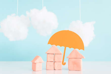 umbrella over a house,concept of security and insurance of propertyの写真素材