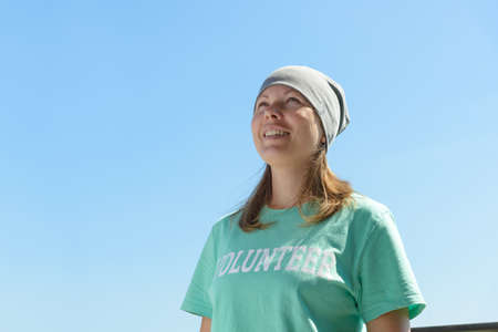 happy volunteer woman outdoors portrait