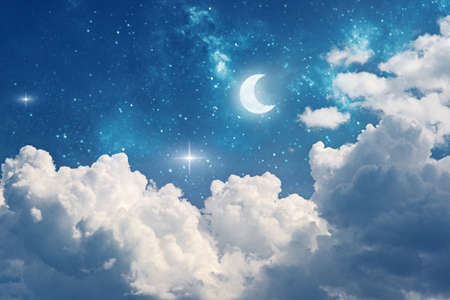 fantasy night sky background with stars, moon and cloudsの写真素材