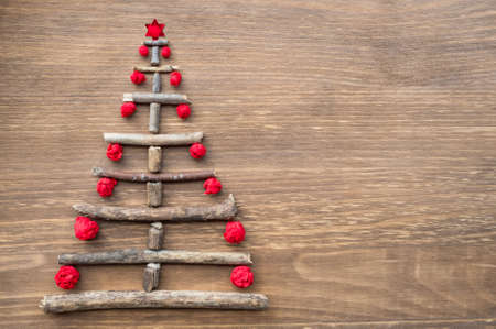 scrap DIY christmas tree on wooden backgroundの写真素材