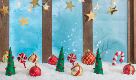 christmas background with window sill illuminated with lights and ornamentsの写真素材