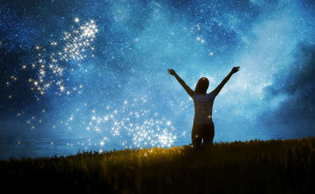 Girl watching the stars in night sky fantasy landscape