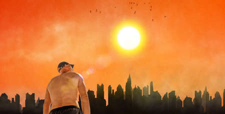 man suffering from hot weather and pollution in city, scorching summer day in heat waveの写真素材