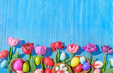 eggs and tulips easter wooden backgroundの写真素材