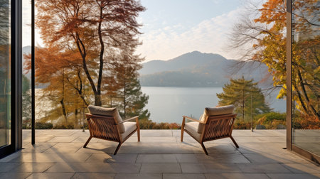 sunset mountains lake wooden patio with two armchairs, relax in outdoor and autumn nature conceptの素材
